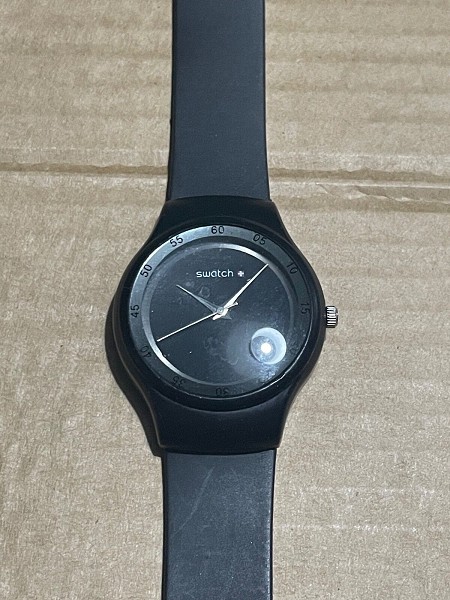 Swatch unisex quartz watch with black rubber strap
