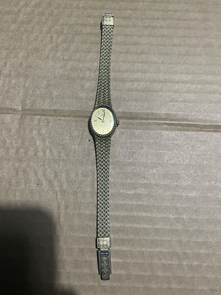 Ladies gold coloured watch with clip strap