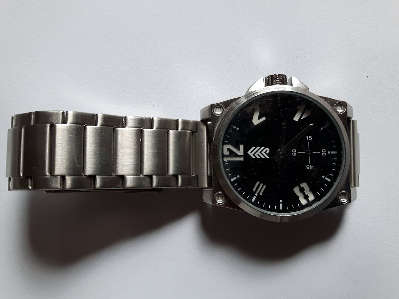 Large faced stainless steel watch with black face